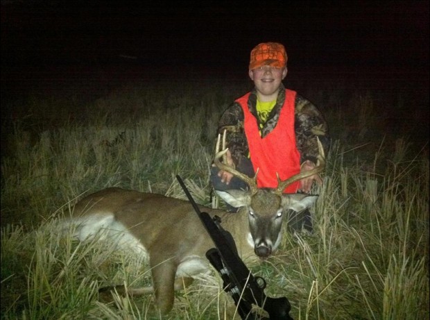 Logan Reed 12 of Benton near Gillett, AR with deer he killed with his birthday rifle
