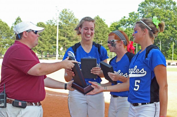 Karisa Hendrix, Felicia Woodard, and Kacey Rasnic accept 4th place trophy for Williams Baptist College Lady Eagles