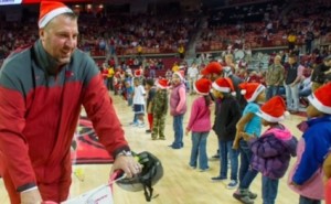 Bielema hands out bikes during halftime of Razorback basketball